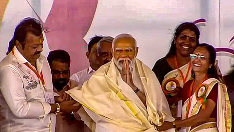 Prime Minister Narendra Modi being felicitated at a public meeting, ahead of Lok Sabha elections, in Alathur.