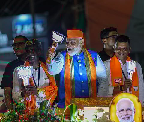 Prime Minister Narendra Modi at the roadshow in Mangaluru.