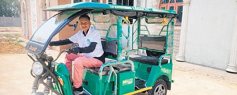 A PwD along with his e-rickshaw 