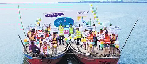 Officials approaching Batighar island by boats to encourage people to vote 
