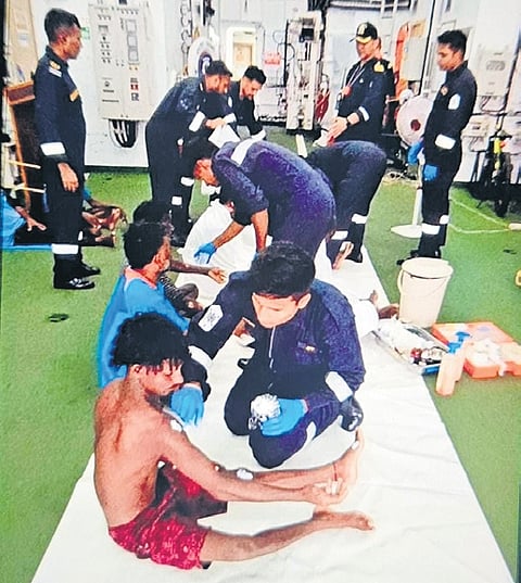 Indian Coast Guard personnel administering first aid to the injured fishermen on Friday