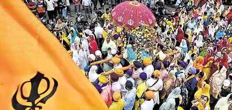 Sikh devotees take part in the Nagar Kirtan in Ameerpet, Hyderabad, on Saturday.