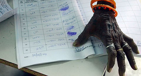 A voter gives her thumb impression before casting her vote for the first phase of Lok Sabha elections, in Gaya, Friday, April 19, 2024. 