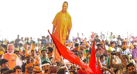 People attend a public meeting of Uttar Pradesh Chief Minister Yogi Adityanath ahead of Lok Sabha elections, in Bijnor district, Tuesday, April 16, 2024.