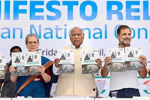 Congress President Mallikarjun Kharge with senior party leaders Sonia Gandhi and Rahul Gandhi releases the party's manifesto ahead of Lok Sabha elections, in New Delhi, Friday, April 5, 2024.