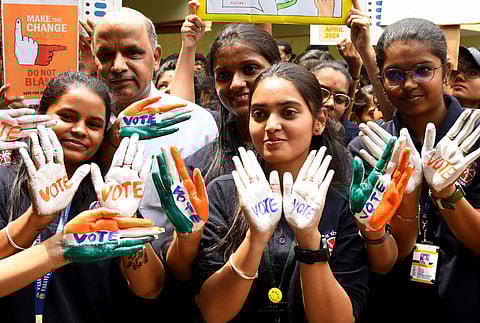 Students of Vasavi Education Board create voting awareness in Bengaluru on Saturday 