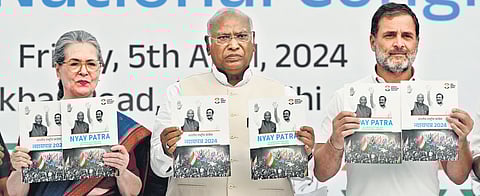 Congress president Mallikarjun Kharge with Sonia Gandhi and Rahul Gandhi, releasing the party’s manifesto.