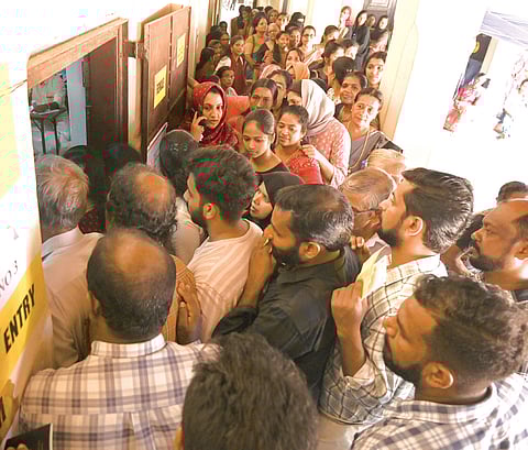 A long queue outside the polling booth at Kadathanad Raja Higher Secondary School, Kozhikode. 