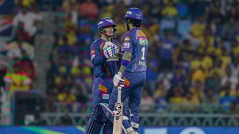 Lucknow Super Giants' captain KL Rahul, right, celebrates his fifty runs with his batting partner Quinton de Kock during the Indian Premier League cricket match between Chennai Super Kings and Lucknow Super Giants in Lucknow