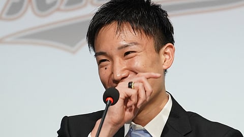 Japan’s badminton player Kento Momota attends a press conference to announce his retirement from Japan national team in Tokyo on April 18, 2024.