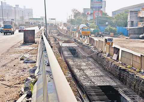 Construction work underway on the service lane at Senneerkuppam on the National Highway between Maduravoyal and Sriperambadur 