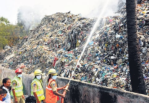 Firefighters dousing flames at dumping yard on Wednesday