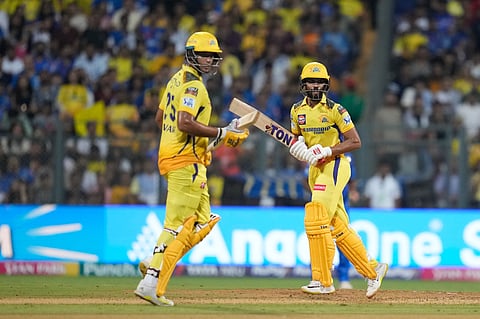 Chennai Super Kings' captain Ruturaj Gaikwad , right, along with Shivam Dube run between the wickets during the Indian Premier League cricket match between Mumbai Indians' and Chennai Super Kings'