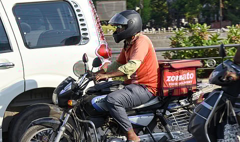 A food delivery worker commuting under the scorching sun in Tiruchy 