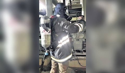 Safety personnel fixing the leak 