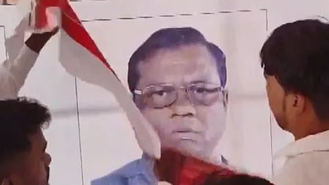 BJP candidate Faggan Singh Kulaste on a banner at Rahul Gandhi's rally in Madhya Pradesh.