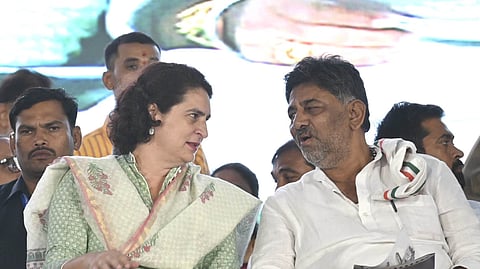 Congress leader Priyanka Gandhi Vadra has a word with Deputy Chief Minister DK Shivakumar during a campaign rally for Bengaluru. (Photo | Shashidhar Byrappa, EPS)