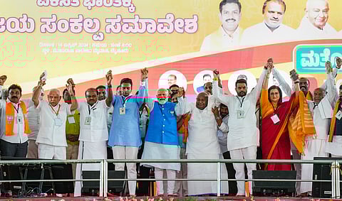 Prime Minister Narendra Modi, JD(S) Supremo and former PM H D Devegowda, BJP leaders B S Yediyurappa, Sumalatha and NDA candidates Yaduveer, Balraj, H D Kumaraswamy and Prajwal Revanna during an election campaign rally ahead of Lok Sabha election in Mysuru, Sunday, April 14, 2024.