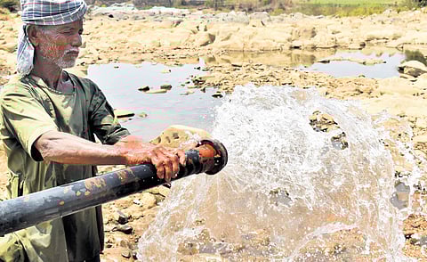 (Above) Farmer Govind Gundappa Gundkal from Masalikatti village in Kalaghatagi taluk pumps water into the stream for animals 