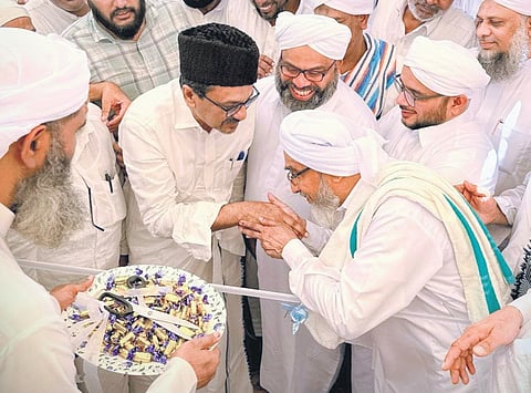Moulana Najeeb Moulavi receiving Panakkad Syed Sadiq Ali Shihab Thangal during the inauguration of the Taibah Centre in Kozhikode on Saturday.