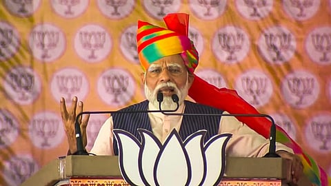 Prime Minister Narendra Modi addresses a public meeting ahead of Lok Sabha elections, in Barmer district, Rajasthan, Friday, April 12, 2024.