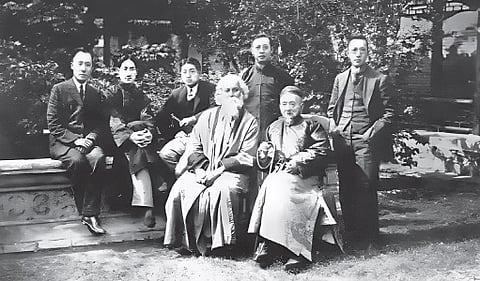 Prof Gu Hongming (sitting) with Rabindranath Tagore and others