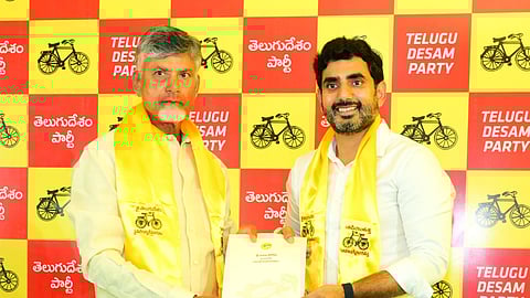 TDP chief Chandrababu Naidu handing over B-form to his son & Mangalagiri contestant Nara Lokesh.