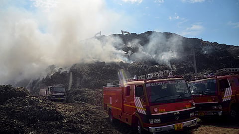 Firefighters at the Ghazipur landfill site where a fire broke out on April 22, in New Delhi. (Photo | Parveen Negi, EPS)