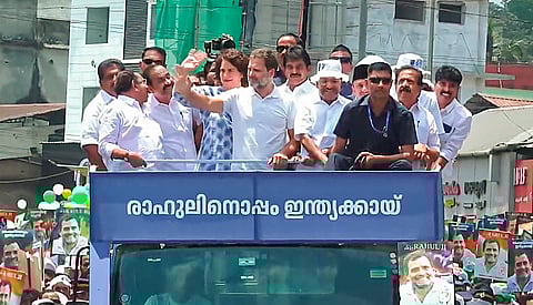 Congress candidate Rahul Gandhi with party leaders Priyanka Gandhi and K.C. Venugopal during a road show before filing his nomination papers for the upcoming Lok Sabha elections, in Wayanad district, Wednesday, April 3, 2024
