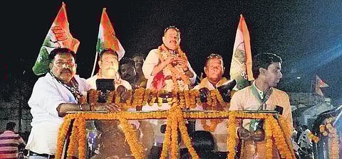 Bahinipati atop an open jeep during a road show in Borigumma block