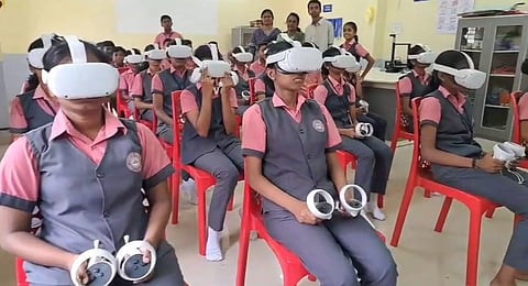 Students trying out the VR headsets at GHSS, Puthoor