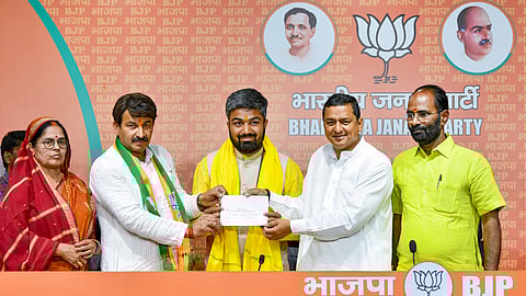 BJP leader Manoj Tiwari welcomes Manish Kasyap as he joins BJP, in New Delhi, Thursday, April 25, 2024.