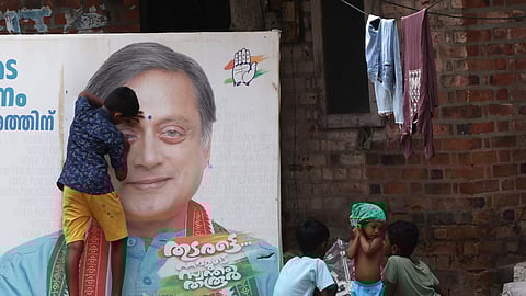 A boy gives his own twist to a poster of Shashi Tharoor who is seeking a fourth term from Thiruvananthapuram Lok Sabha constituency.