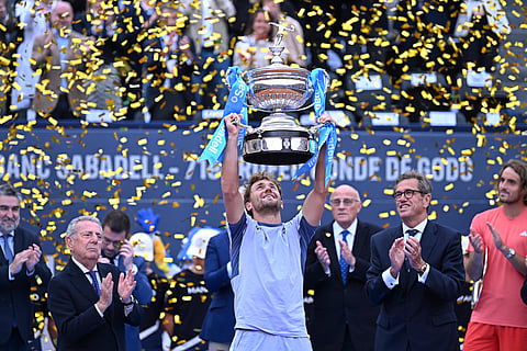 Casper Ruud of Norway lifts the trophy after defeating Stefanos Tsitsipas of Greece during the final of the Barcelona Open tennis tournament in Barcelona, Spain, Sunday, April 21, 2024.