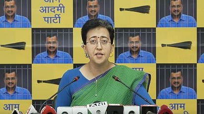  Delhi Cabinet minister Atishi addresses a press conference. 