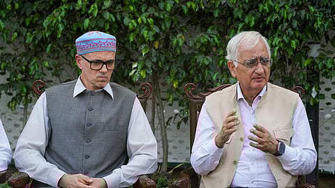 Congress leader Salman Khurshid and J&K National Conference leader Omar Abdullah during a press conference, in New Delhi.
