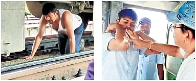 Assistant loco pilot G Rajath Kumar crawling under Visakhapatnam-Guntur Simhadri Express to reset the alarm chain device on Saturday 