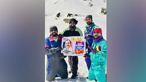 Sreenil M, Udayakumar, Suresh A and Arun Balakrishnan pose with the election campaign poster of M V Balakrishnan, the LDF candidate from the Kasaragod Lok Sabha constituency, in Manali.