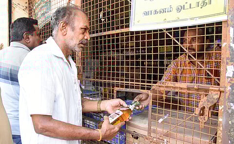 Consumers getting Beer bottle from TASMAC outlet on Thursday, July 10, 2025