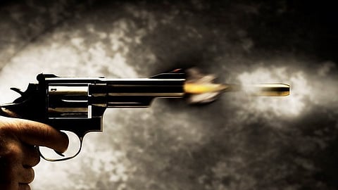 The bodies were discovered in the same room, and three loaded pistols were found next to their bodies, the police said.