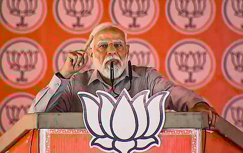  BJP supporters during a public meeting to be addressed by Prime Minister Narendra Modi, ahead of the upcoming Lok Sabha election, in Udhampur, Friday, April 12, 2024. 