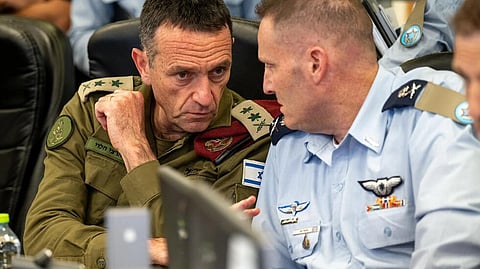 Israeli army chief General Herzi Halevi (L) warned Iran's attack at the weekend would be 'met with a response'