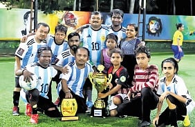 Little People Sports Club team poses with their trophies