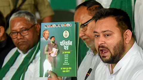 RJD leader Tejashwi Yadav addresses during the release of 'Parivartan Patra' for the Lok Sabha elections, at the party office, in Patna, Saturday, April 13, 2024.