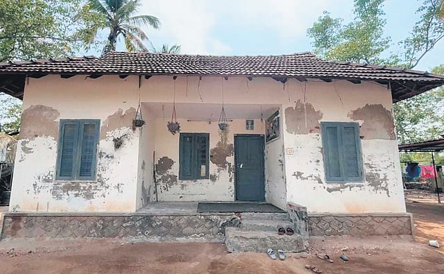 A small, dilapidated cottage in Puthenvelikkara