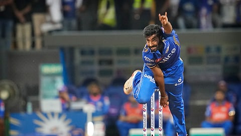 Mumbai Indians' Jasprit Bumrah bowls a delivery during Indian Premier League cricket match between Mumbai Indians and Royal Challengers Bangaluru, in Mumbai