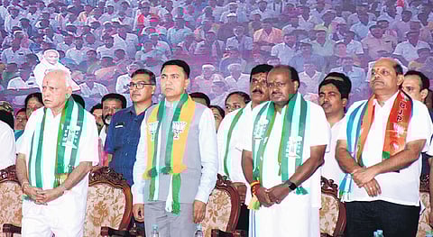 BJP leader and former CM BS Yediyurappa, Goa Chief Minister Pramod Sawant and BJP-JDS alliance candidate HD Kumaraswamy at a public rally in Mandya