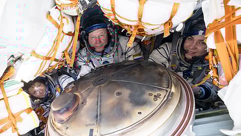 NASA's Loral O'Hara, left, Russia’s Oleg Novitsky and Belarus spaceflight participant Marina Vasilevskaya, right, are seen inside the Soyuz MS-24 spacecraft after they landed in a remote area near the town of Dzhezkazgan, Kazakhstan, Saturday, April 6, 2024.