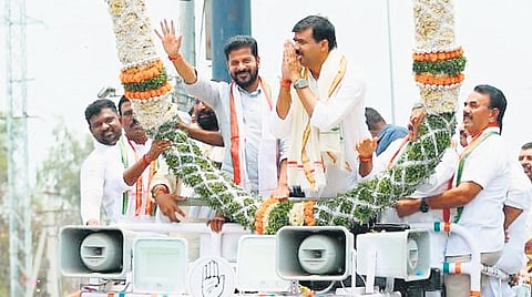 CM A Revanth Reddy greets people during a rally in  Mahbubnagar after Congress candidate Vamshi Chand Reddy filed nomination on Friday. 