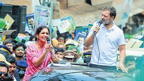 Rahul Gandhi with his translator Jyothi Radhika during his road show on Tuesday .